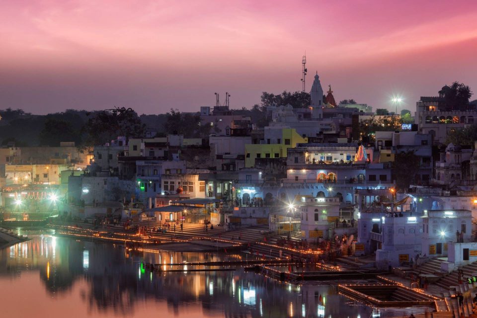 Sacred Puskhar lake (Sagar) and ghats of town Pushkar in twilight in the evening, Rajasthan, India